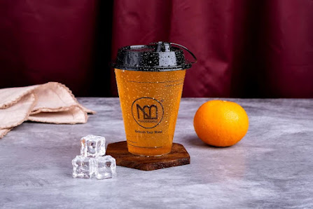 Orange drink shown on the Naadbramha Idli menu